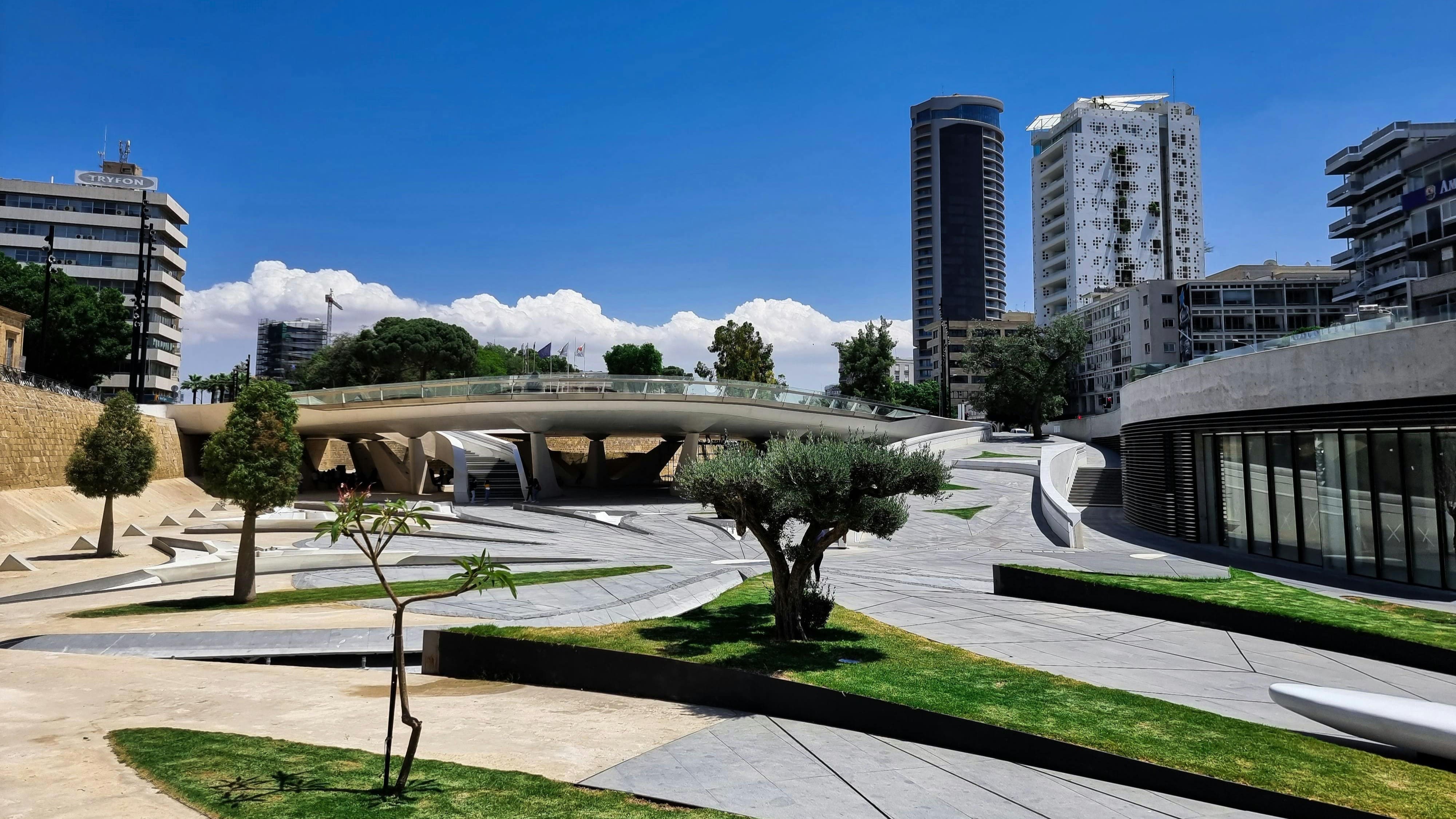 A modern urban square with historical ruins in Nicosia.