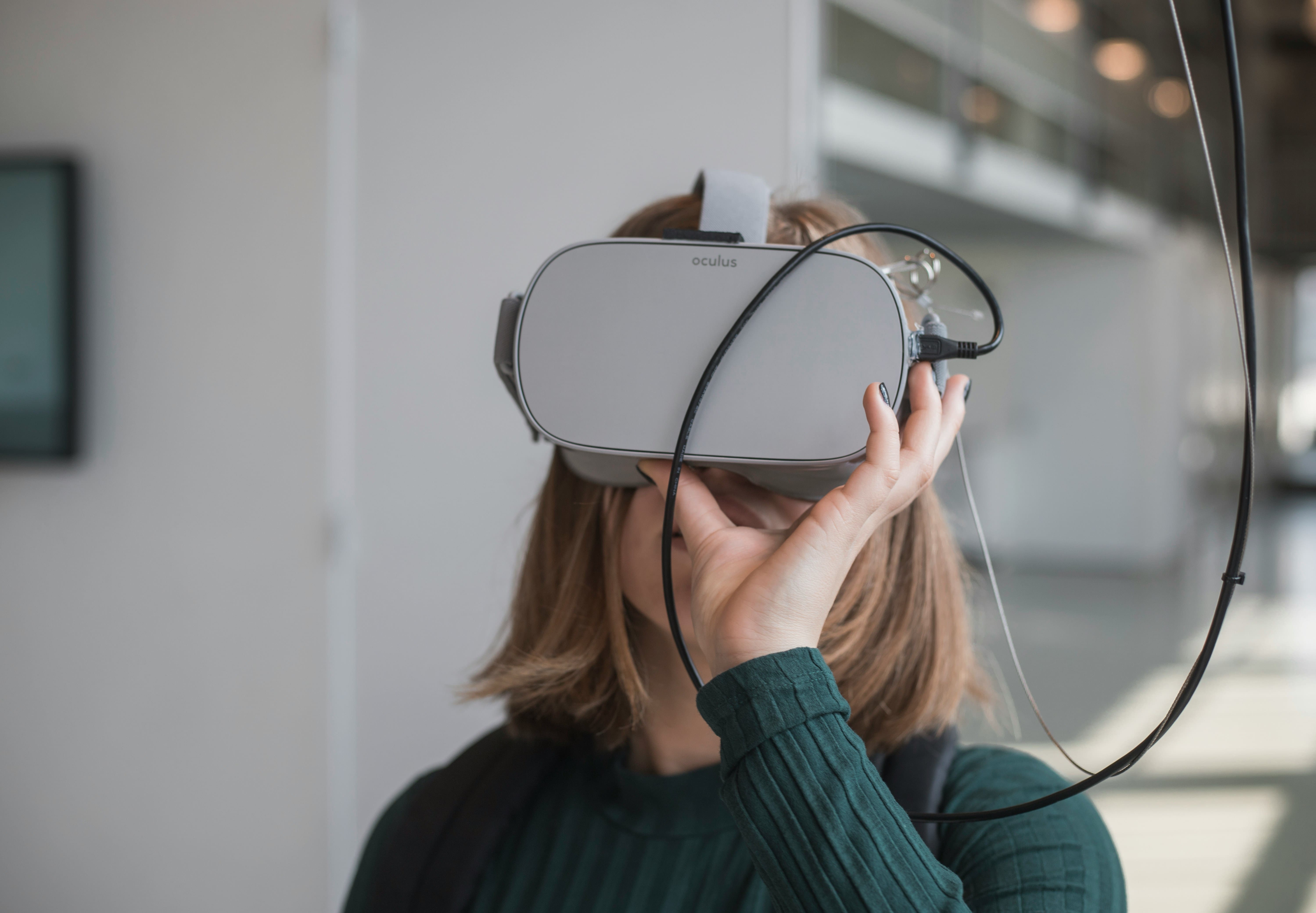 Person using a virtual reality headset for a property virtual tour