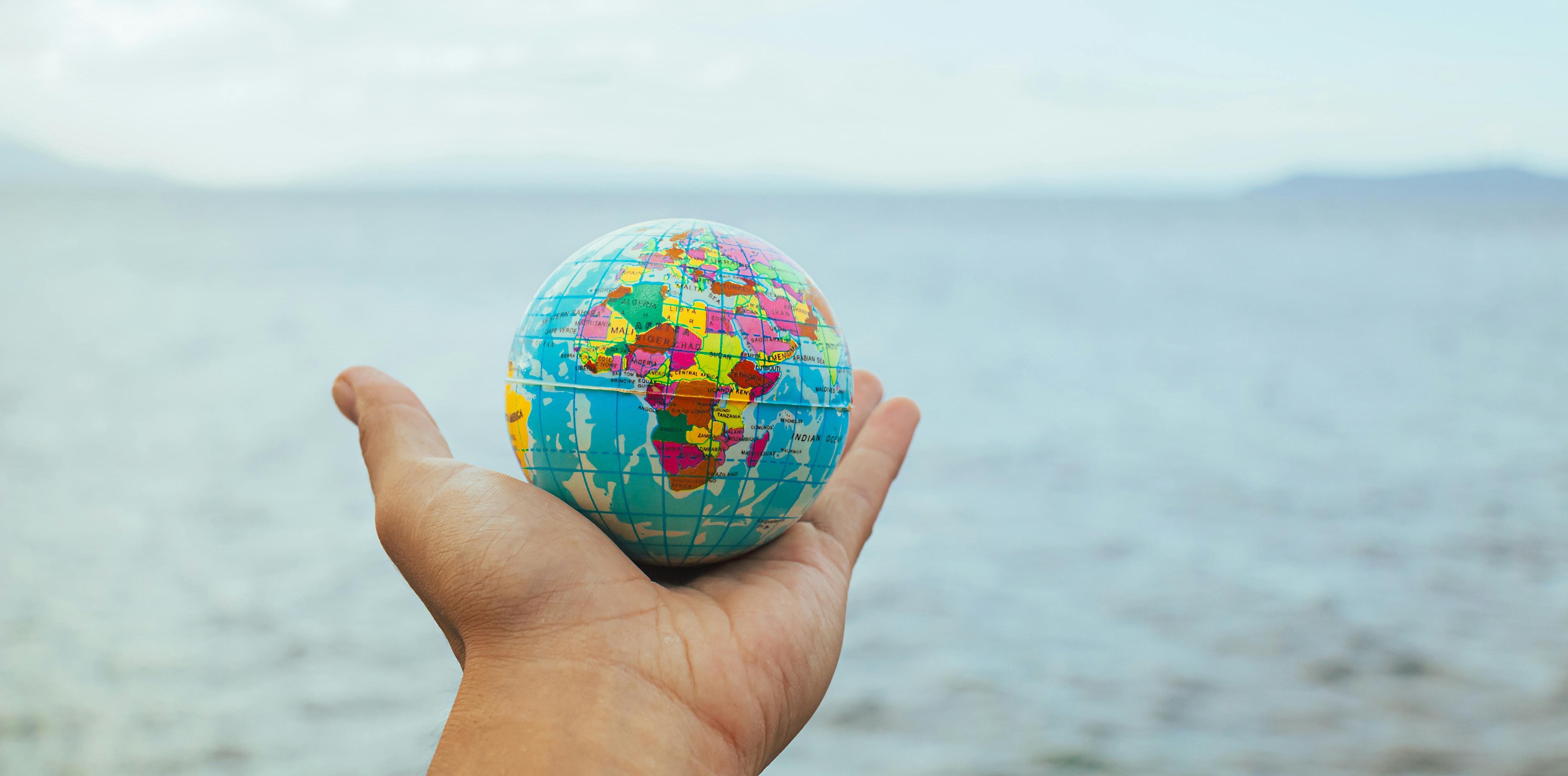 globe with the ocean in the background